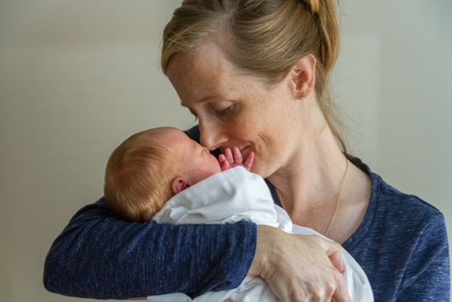 Portrait of Jessica Wilson, a Black woman with braided hair and bright smile