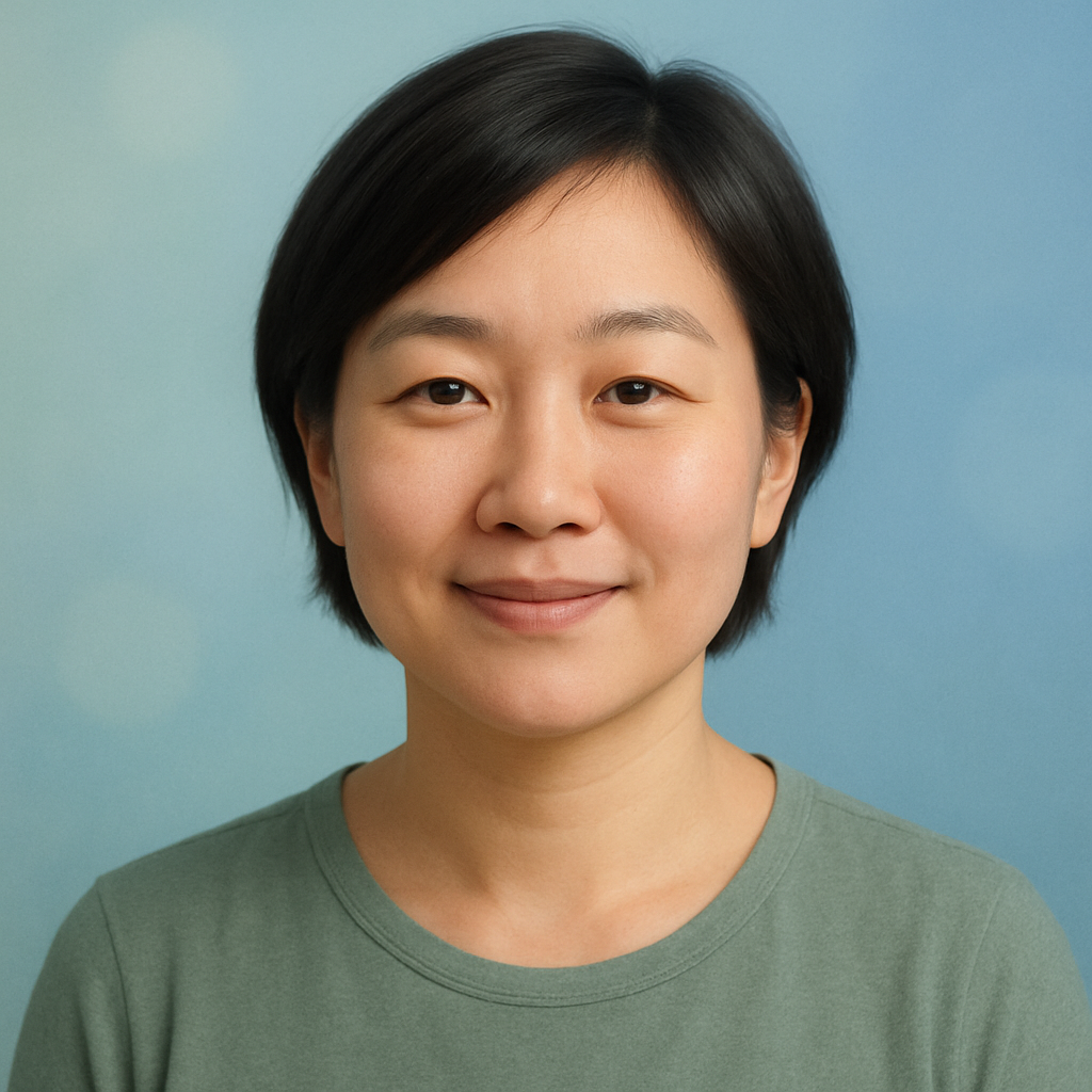 Portrait of Sarah Lee, an Asian woman with short dark hair and a gentle smile