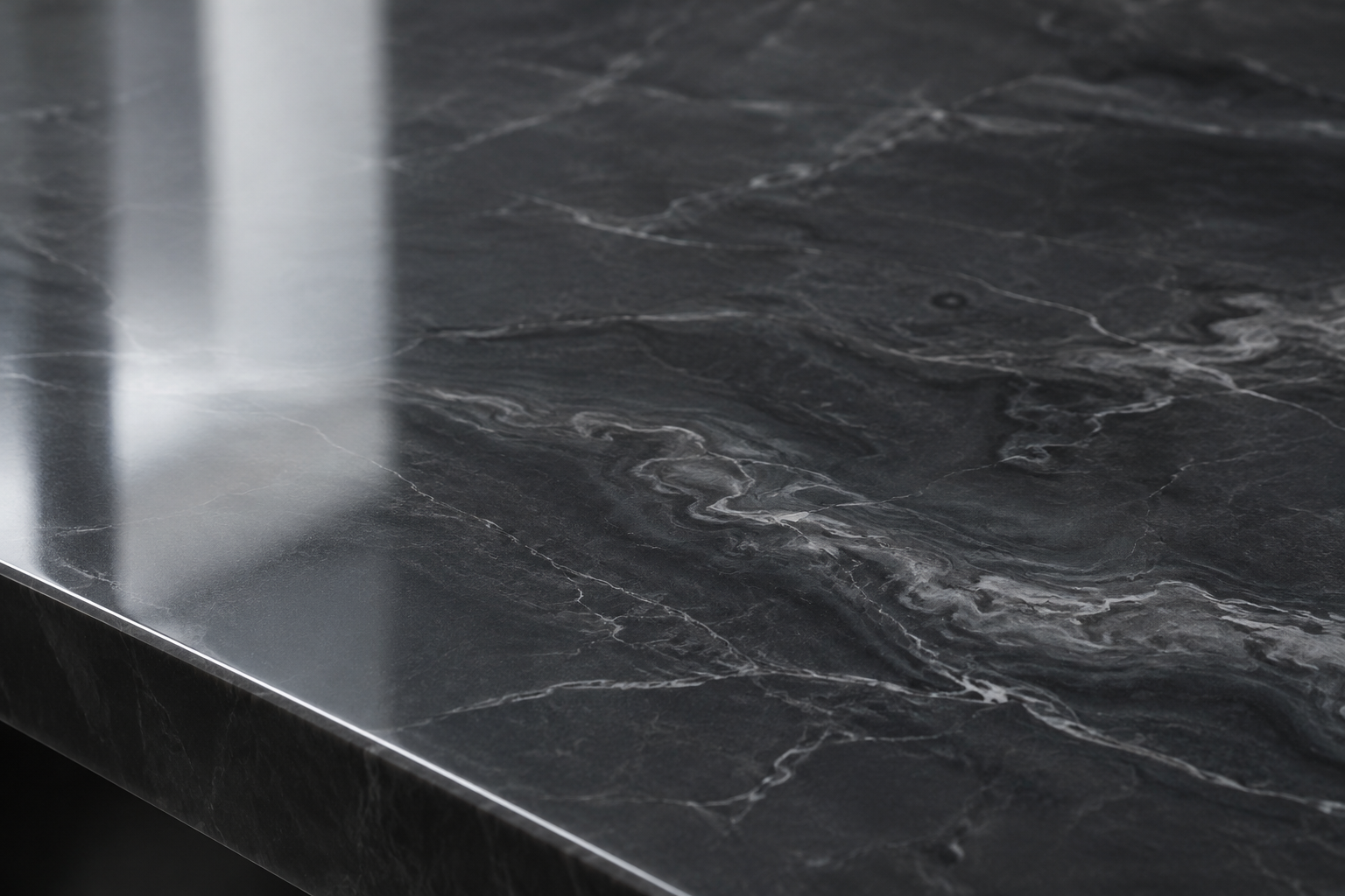 Close-up of glossy charcoal resin surface with subtle light reflections and smooth texture