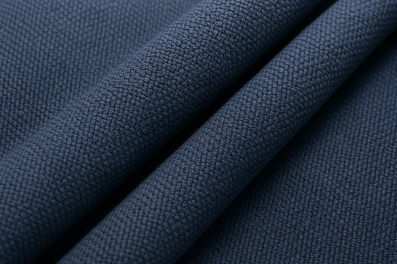 Close-up of textured woven blackout fabric in slate blue with visible yarn depth