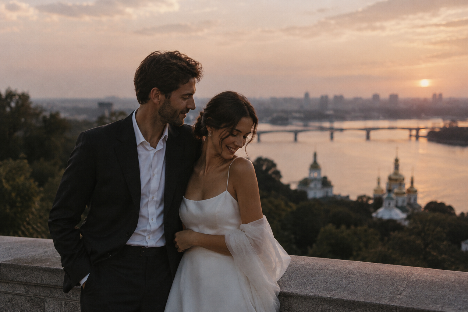 A couple sharing a quiet, candid moment together in soft evening light, photographed with a timeless editorial feel.