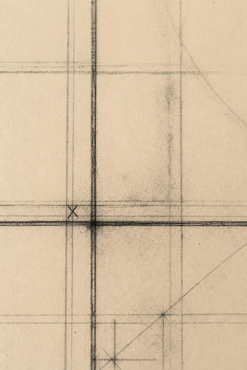 Detail crop of charcoal grid lines over warm cream paper