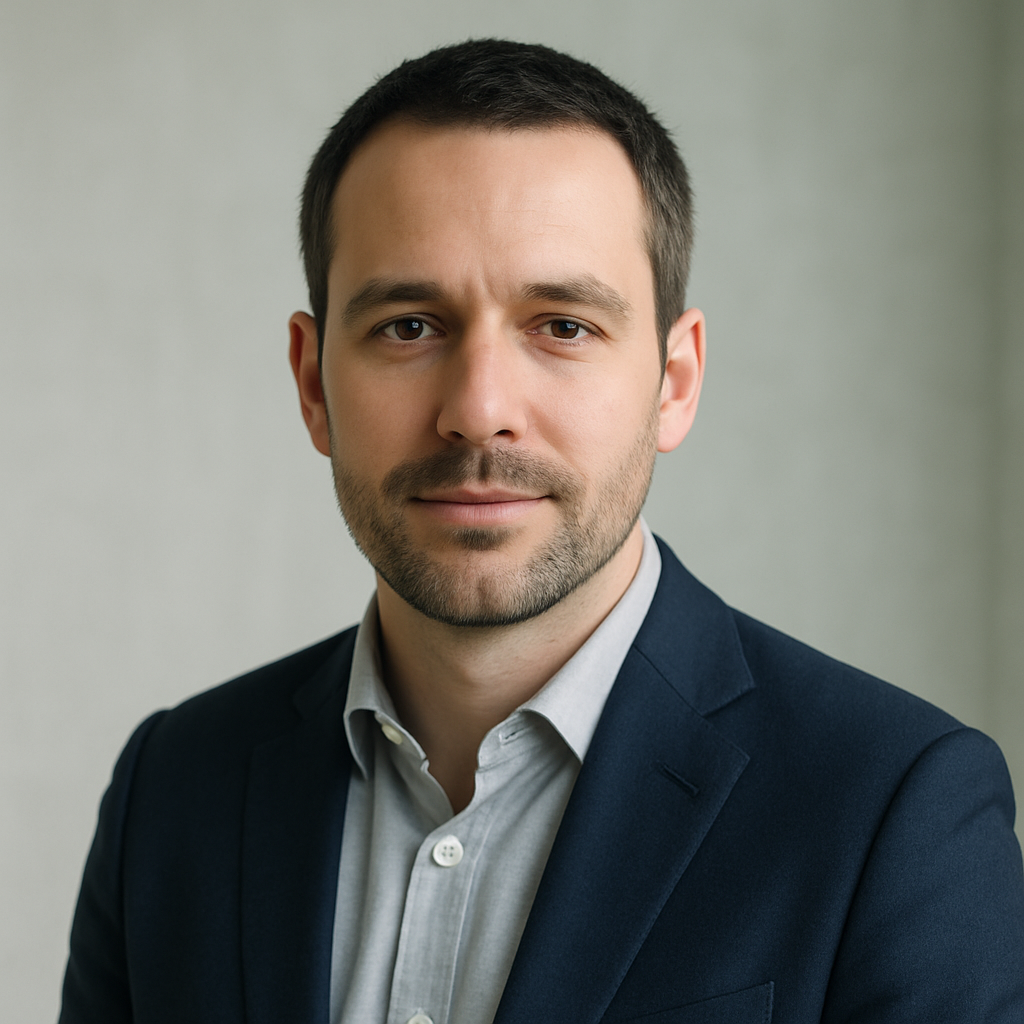 Mykola P., man with short dark hair in a blazer