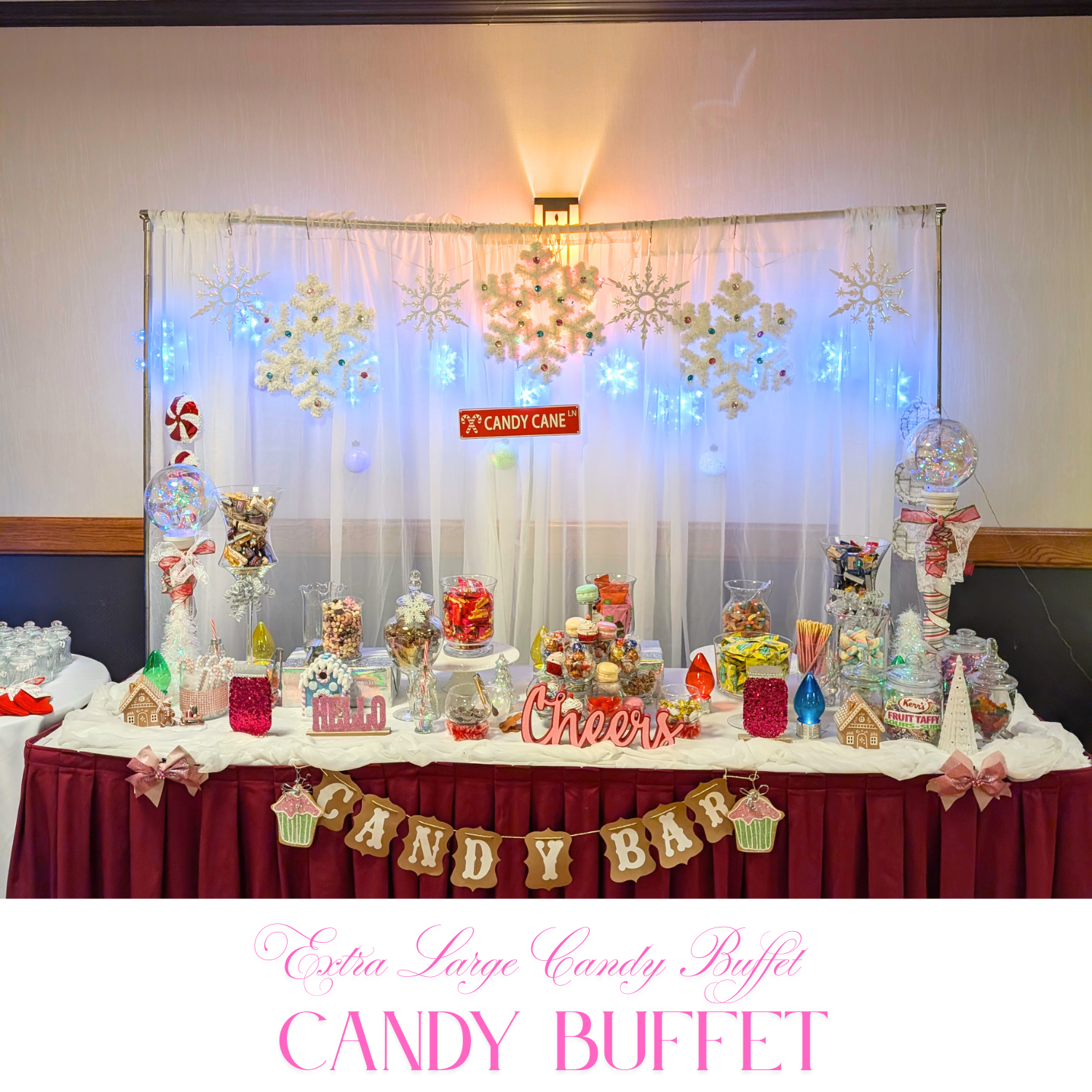 Custom statement buffet with mixed-height stands, themed color palette, and personalized focal decor