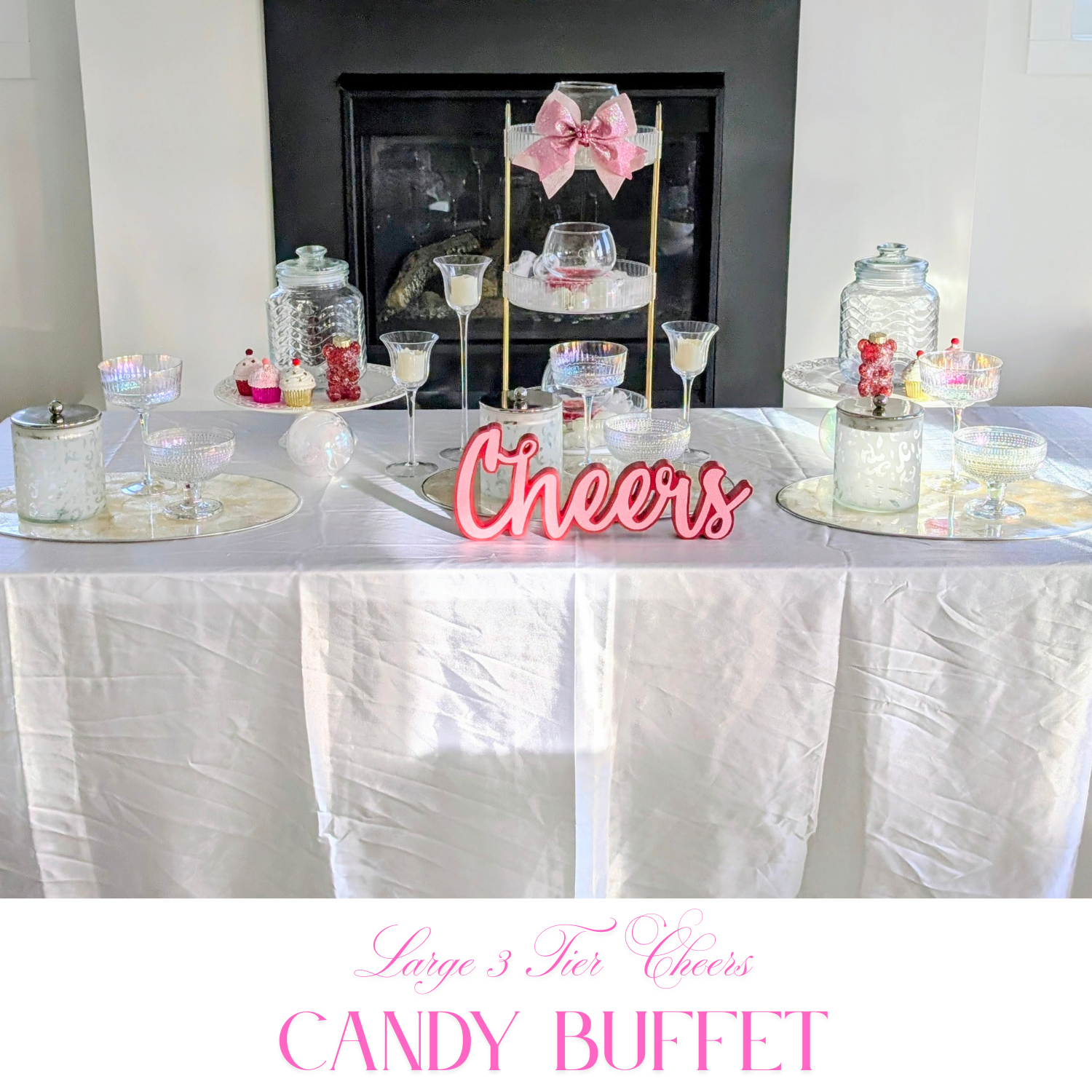 Styled large candy buffet with tiered glassware, decorative bows, and celebration table decor