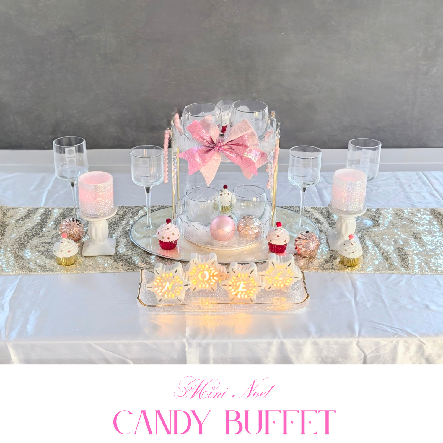Mini candy buffet with blush and ivory sweets, petite floral accents, and clean white tabletop styling