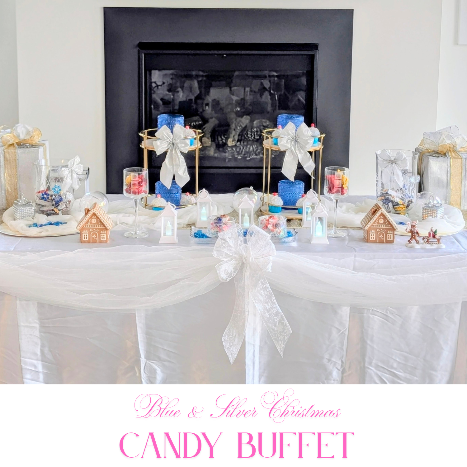 Blue and silver Christmas candy buffet with white bows, lantern accents, gingerbread houses, and elegant table draping