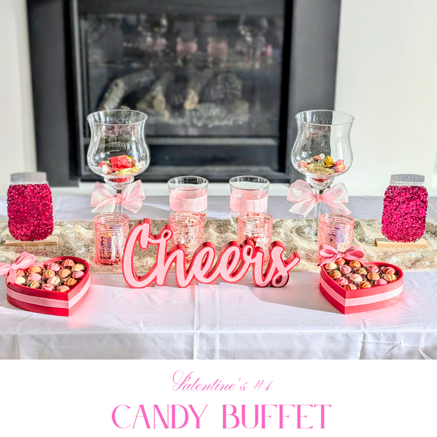 Valentine's Day #1 candy buffet setup with pink bows, crystal jars, heart-shaped candy boxes, and a Cheers centerpiece