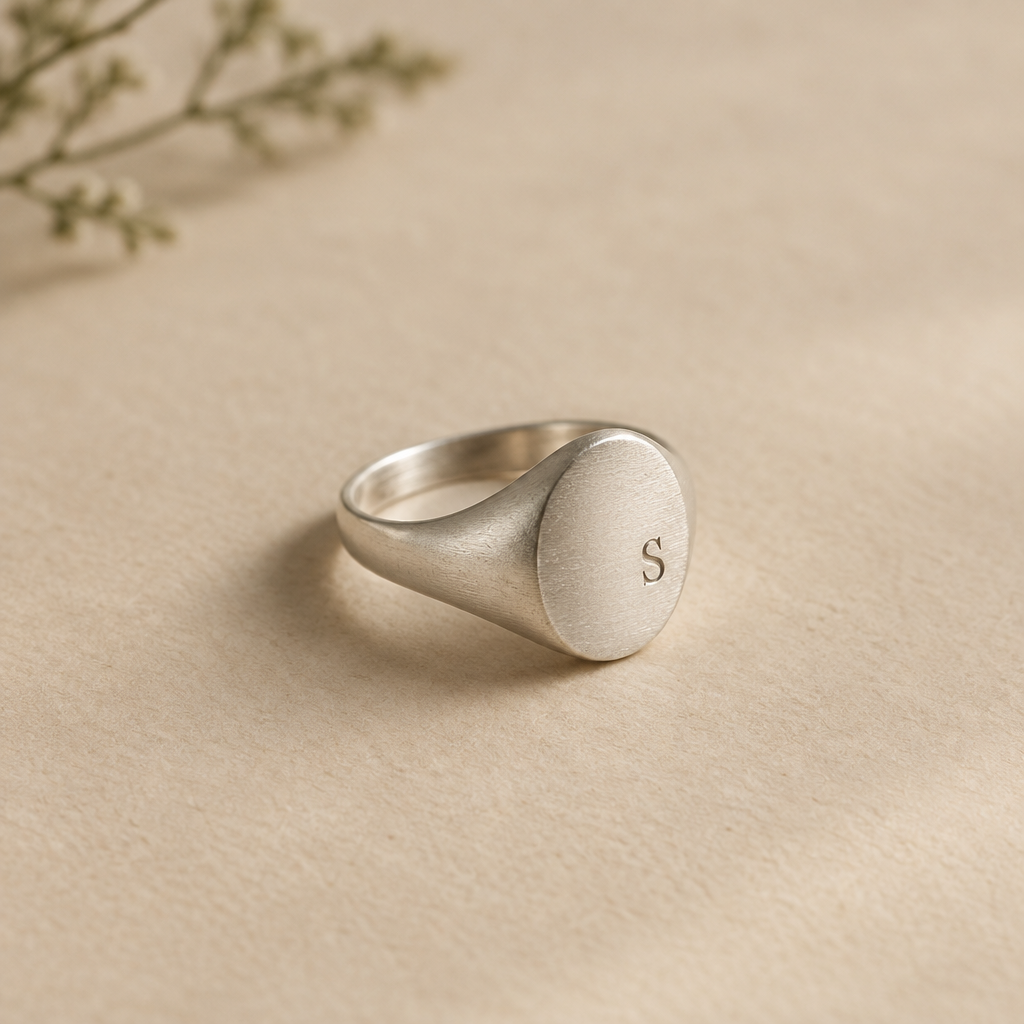 Silver signet ring with a finely engraved initial