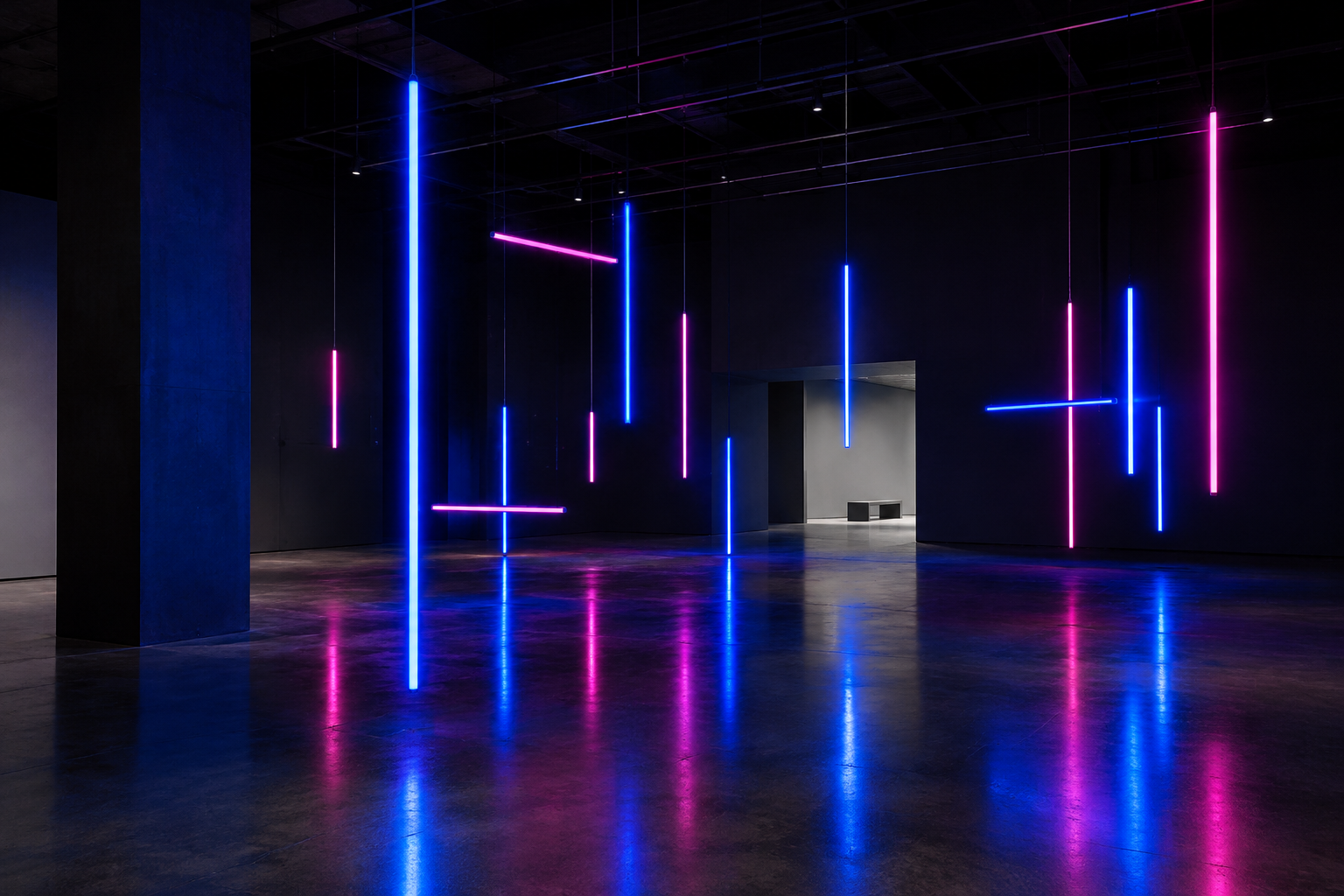 Dark exhibition hall featuring suspended cobalt and magenta light tubes reflected on polished concrete