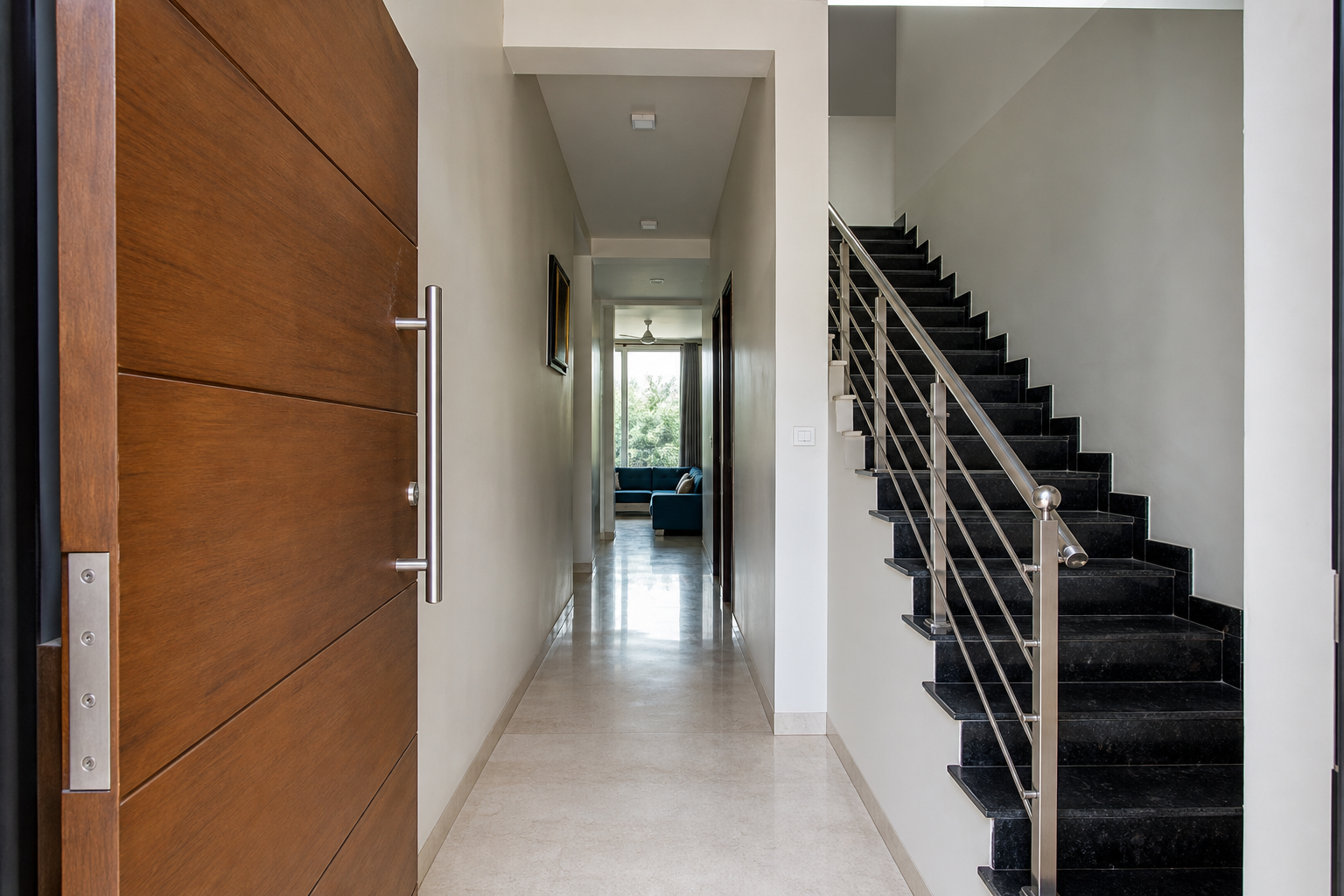 Before state showing residential entry door directly aligned with stair and corridor causing circulation stress