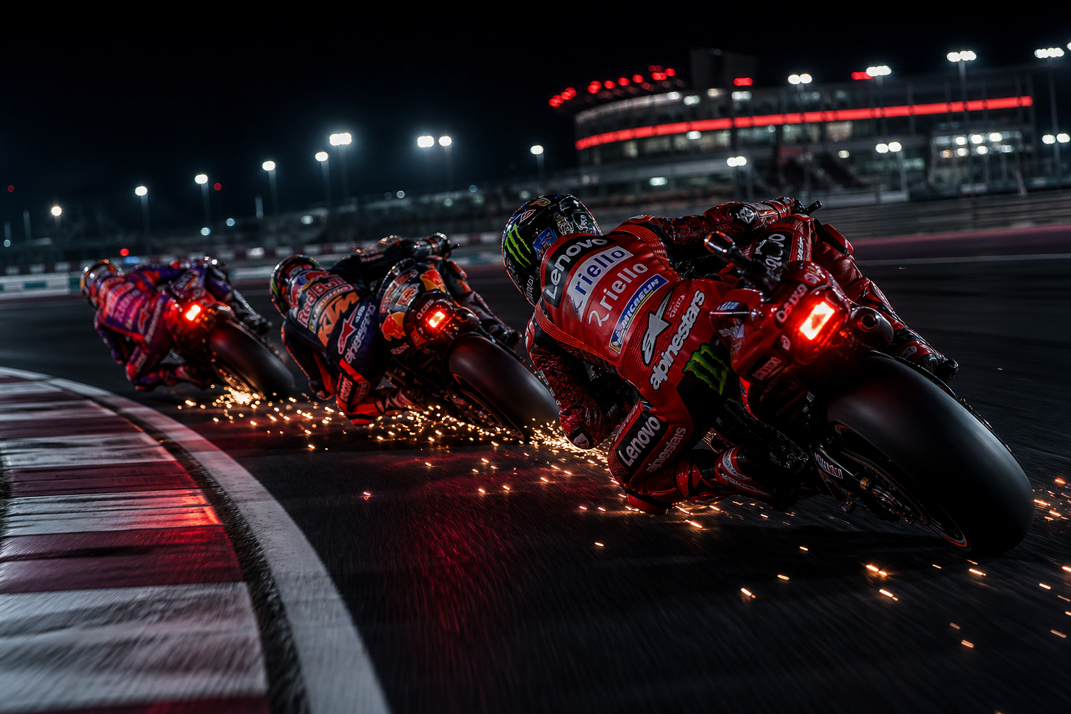 Factory MotoGP riders charging into a night-time corner with sparks and red brake lights