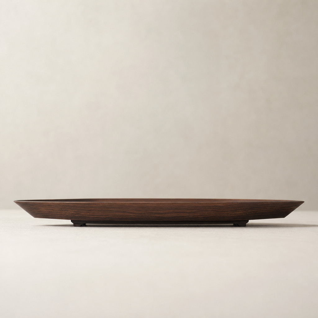 Side profile of the tray showing slim base and tapered silhouette