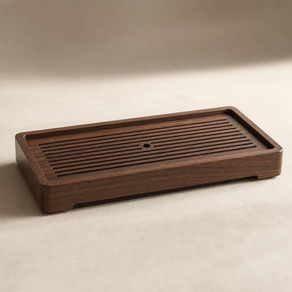 Tea tray resting on neutral surface with soft shadow and warm grain