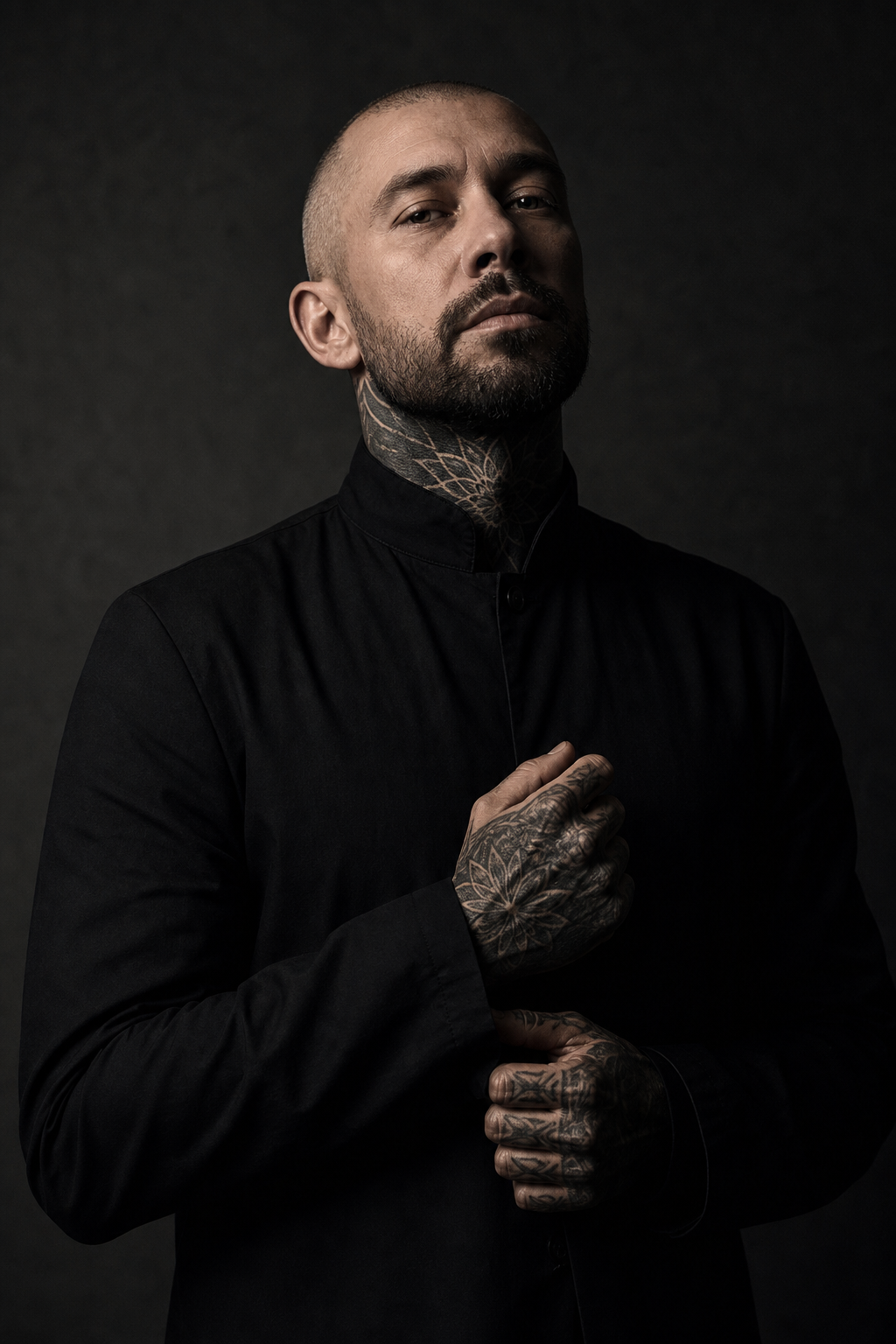 Roman Kade, blackwork specialist in a low-key dramatic portrait