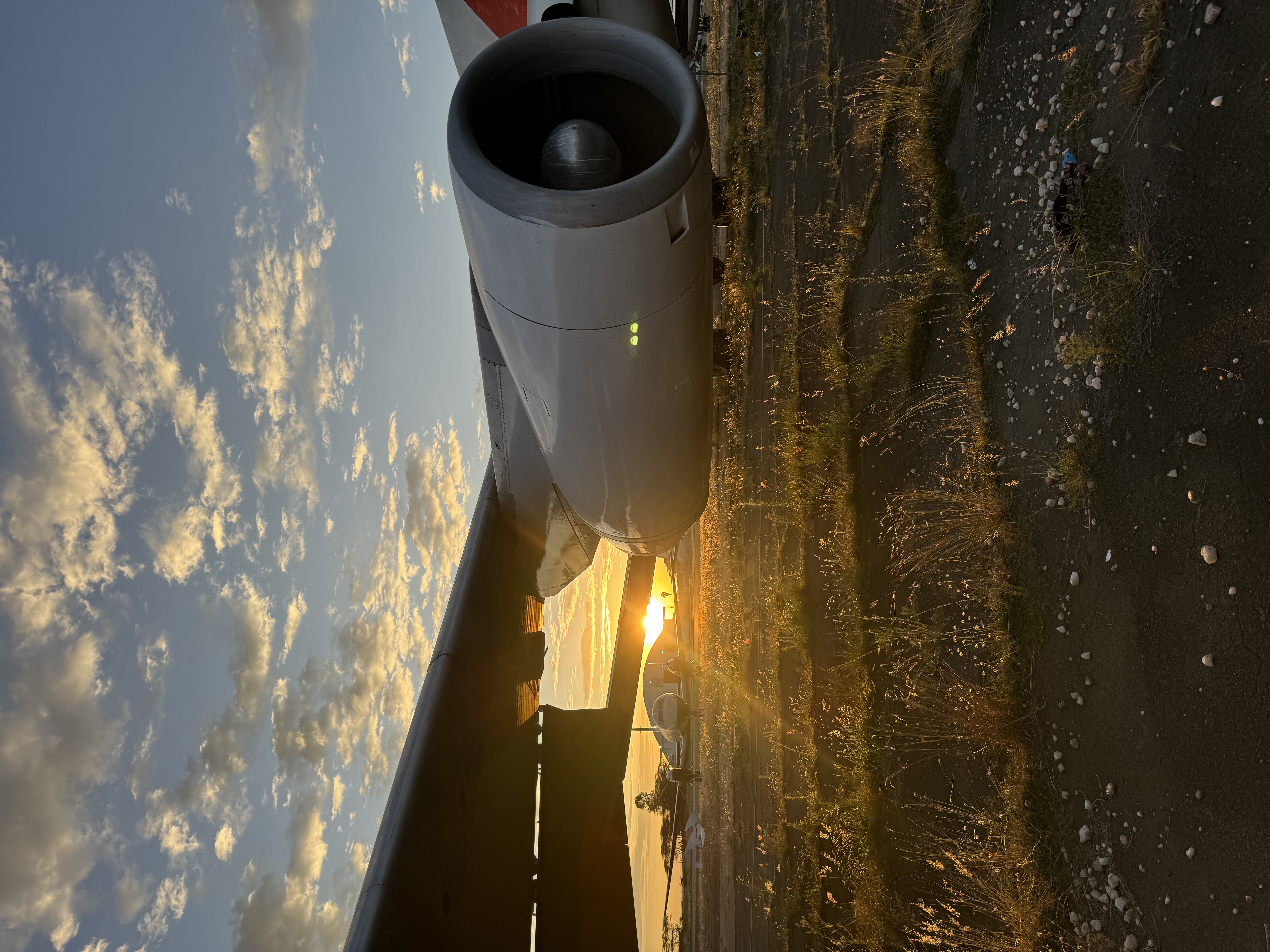 Technical logistics team coordinating aviation support in Africa, field-ready and professional, blue-gray and cream tones, modern documentary style, clear daylight