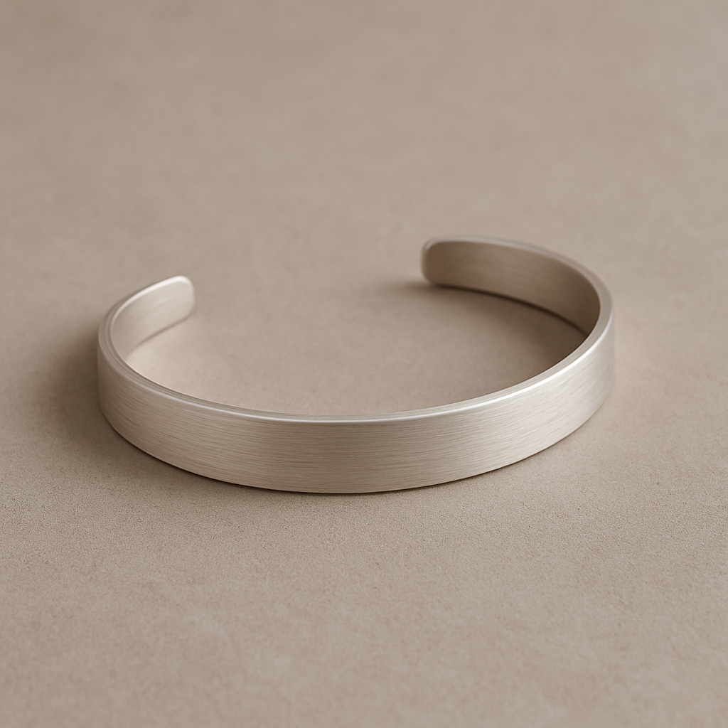 Curved sterling silver cuff with soft brushed texture