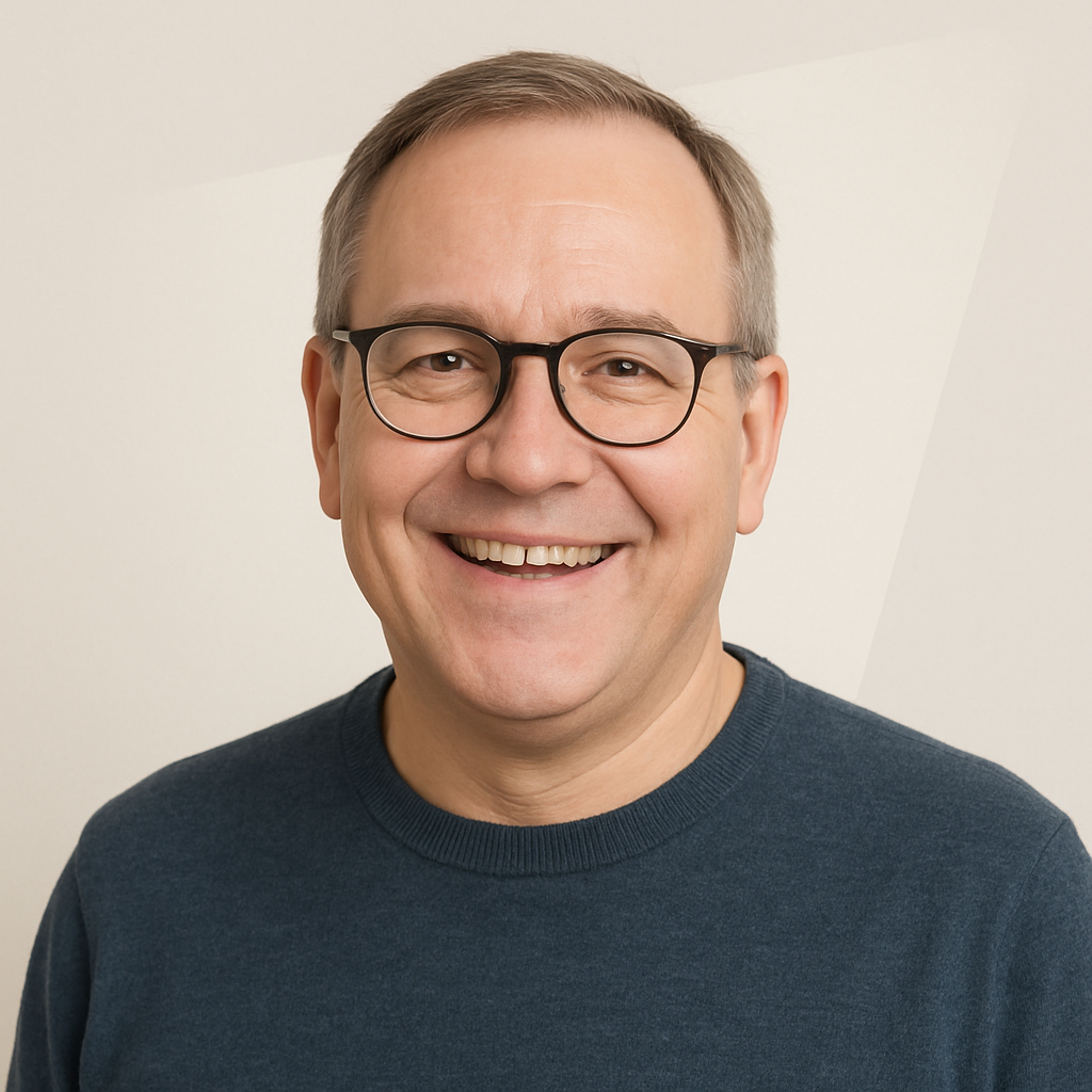 Middle-aged man with glasses, cheerful expression