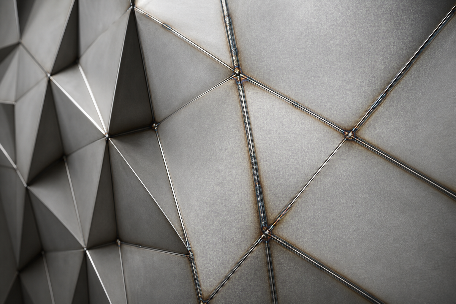 Close-up thumbnail of an artistic fabricated metal panel with patterned texture and satin finish