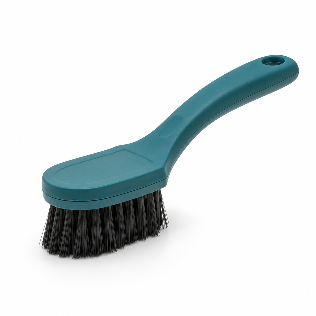 Compact smoke-clean brush with sturdy bristles and teal handle on a white studio background