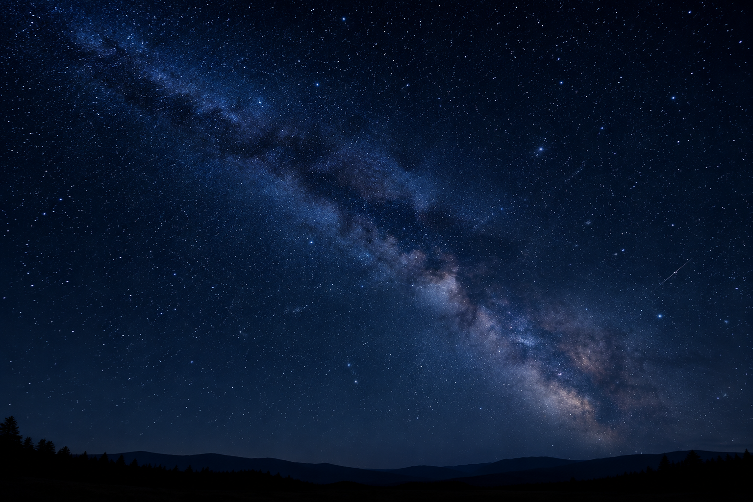 Contemplative night sky above a quiet horizon, filled with crisp stars and a soft Milky Way glow