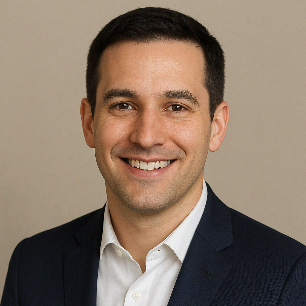 Portrait of Dmytro, a man with short dark hair and a friendly smile