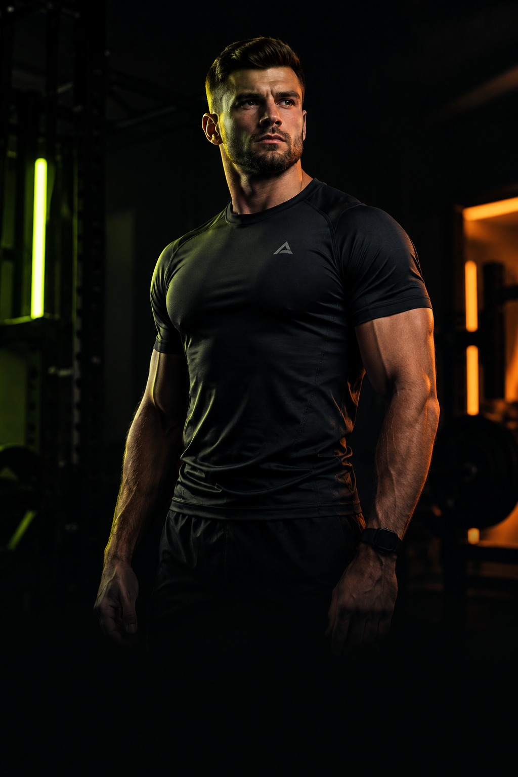 Athletic male fitness coach in a dramatic, low-key training portrait