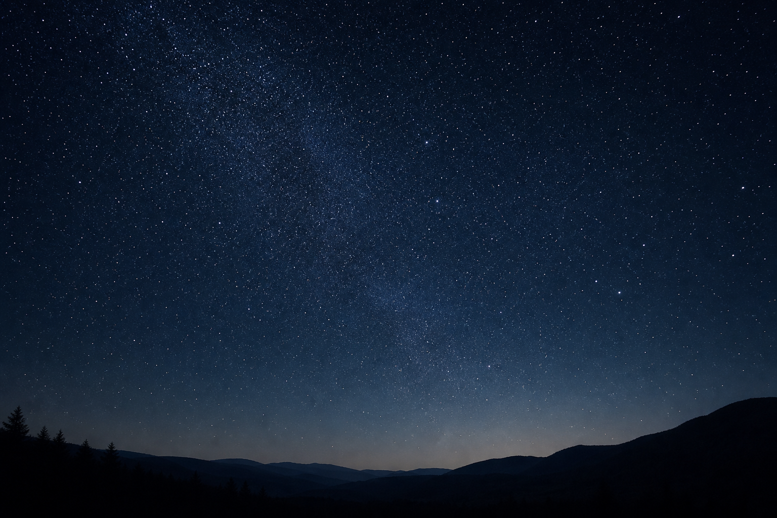 Quiet night sky photograph with dense stars above a dark horizon