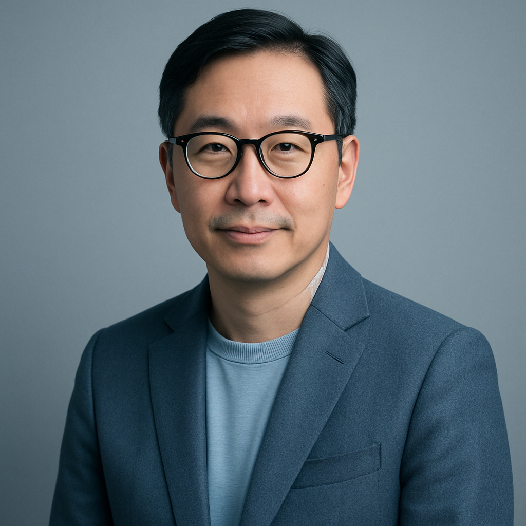 Portrait of Daniel Lee, a middle-aged Asian man with glasses, soft smile, wearing a tailored blazer, clean editorial style, cool blue and silver tones, minimalistic studio lighting
