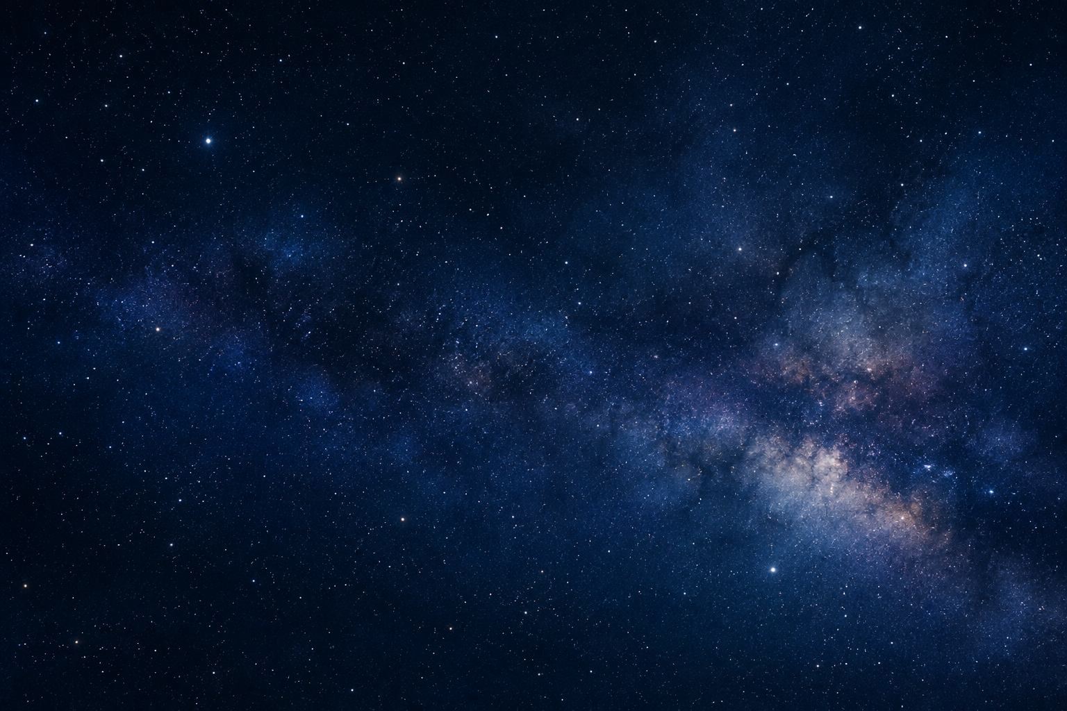 Deep-sky astronomy scene with a wide star field and faint nebula haze across a dark night sky