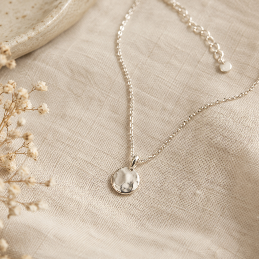 Small rounded sterling silver pendant necklace on a fine adjustable chain