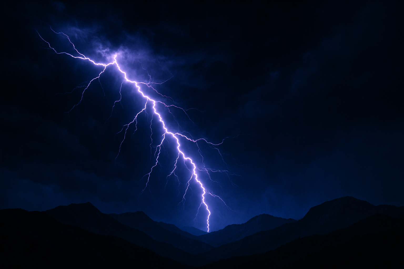 Lightning illuminating a night sky over the ridge