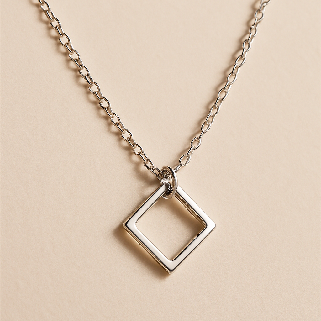 Delicate silver chain necklace with minimalist geometric pendant