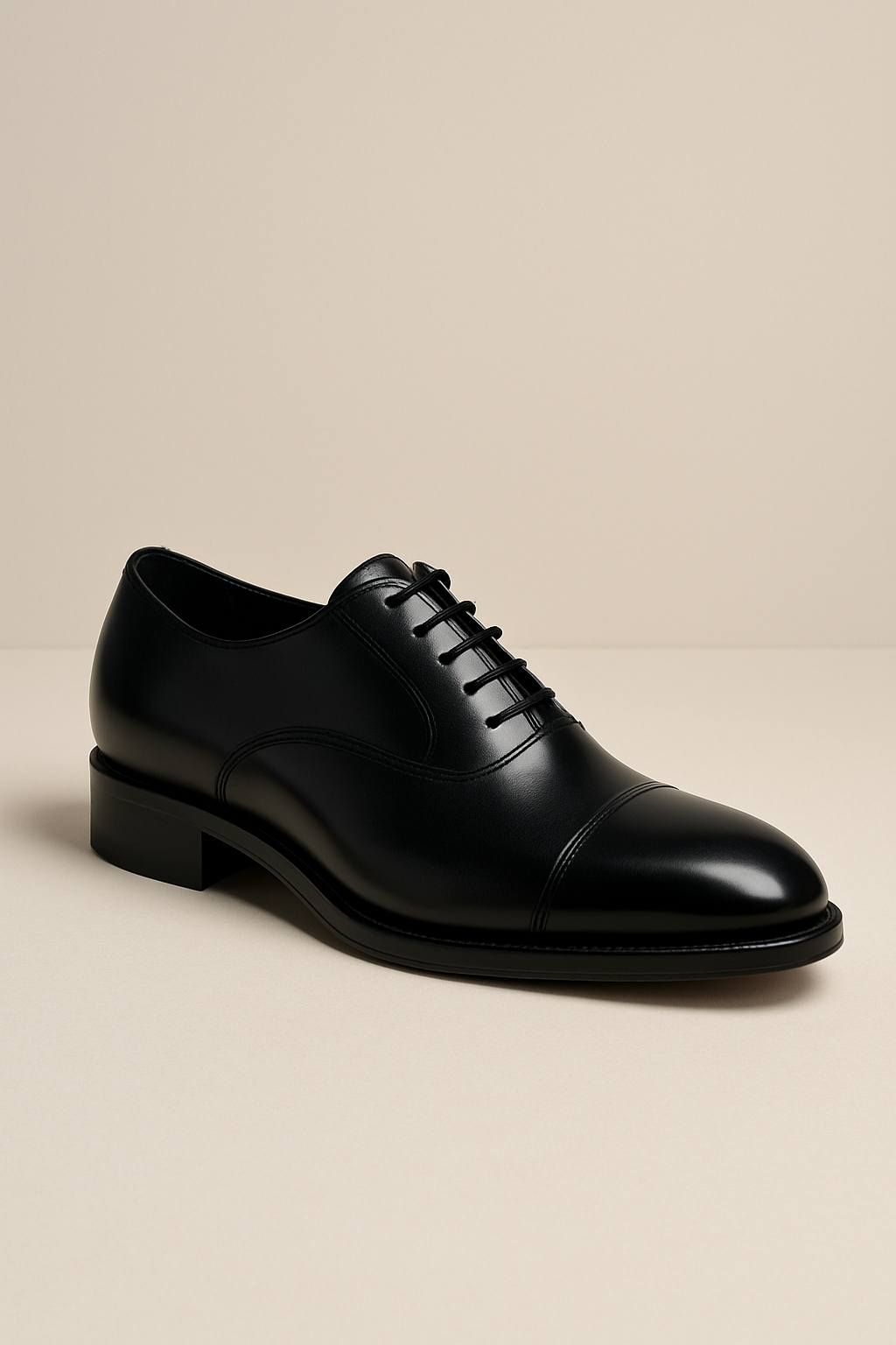 Premium black leather Oxford shoe in a studio setting with polished soft lighting and clean minimal composition