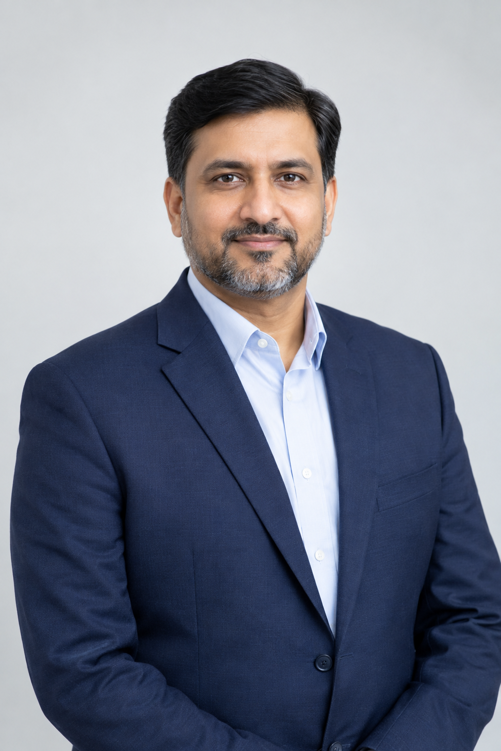 Professional portrait of Muhammad Ibrahim Jarral in business attire with a calm, trustworthy expression