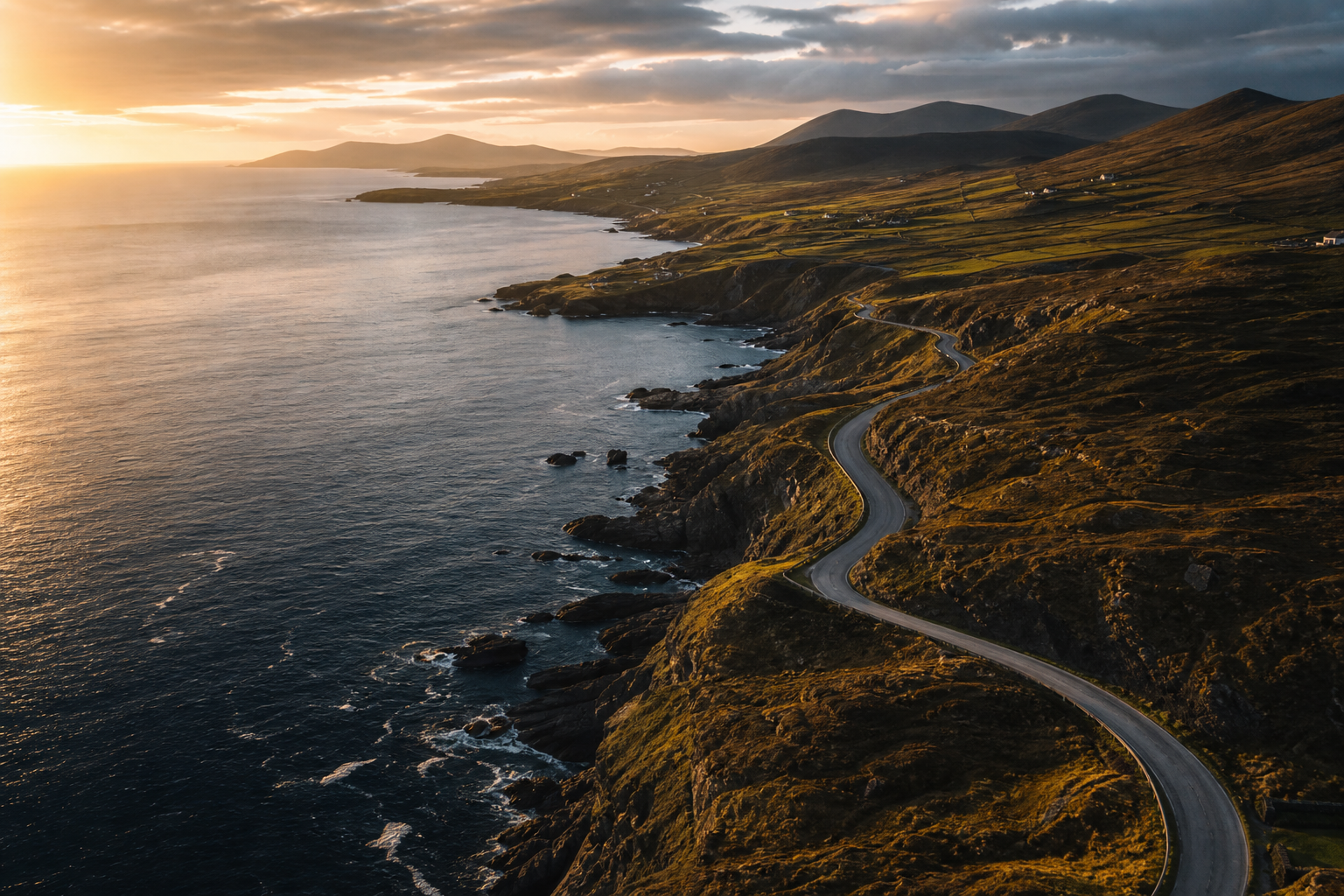 High-altitude aerial view of an Irish coastline and road network captured in dramatic golden-hour haze