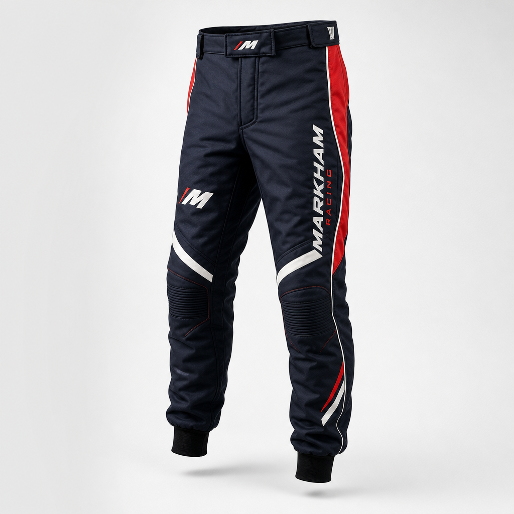 Tapered performance pants in deep navy with sleek paneling, white contrast, and red trim.