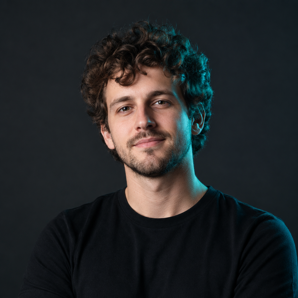 Danylo Levchenko, a Ukrainian JavaScript developer with curly brown hair, wearing a black t-shirt