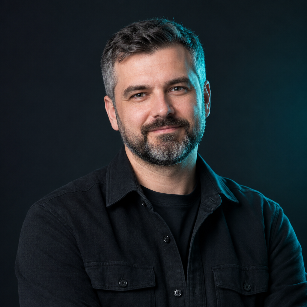 Taras Shevchuk, a Ukrainian engineering manager with salt-and-pepper hair and beard, wearing a dark overshirt