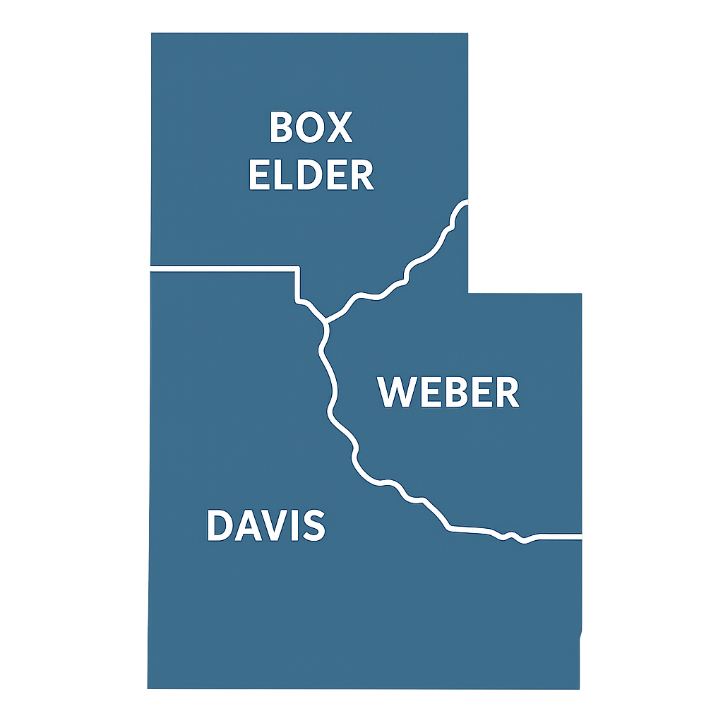 Modern townhome community in Northern Utah with clean lines, light siding, and landscaped walkways on a bright day