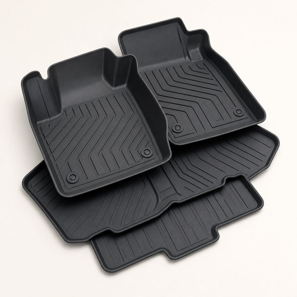 Set of dark rubber floor mats with deep tread texture
