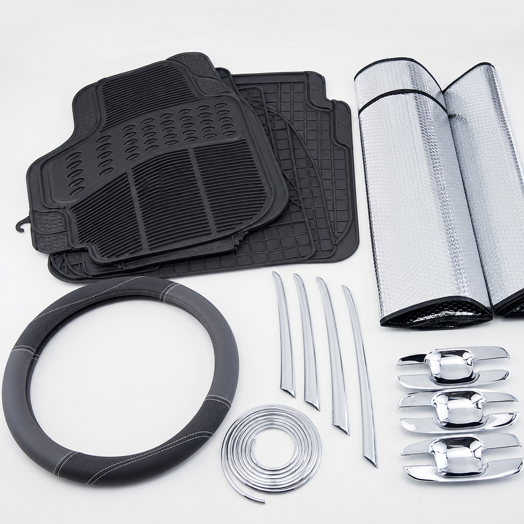 Assorted real car interior and exterior accessories including floor mats, steering wheel covers, and chrome trim pieces on a clean tabletop