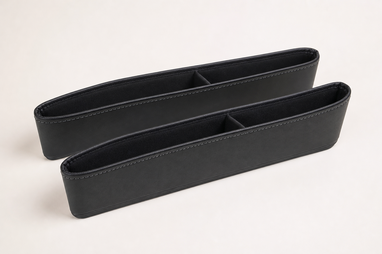 Pair of slim black seat gap filler organizers with stitched trim