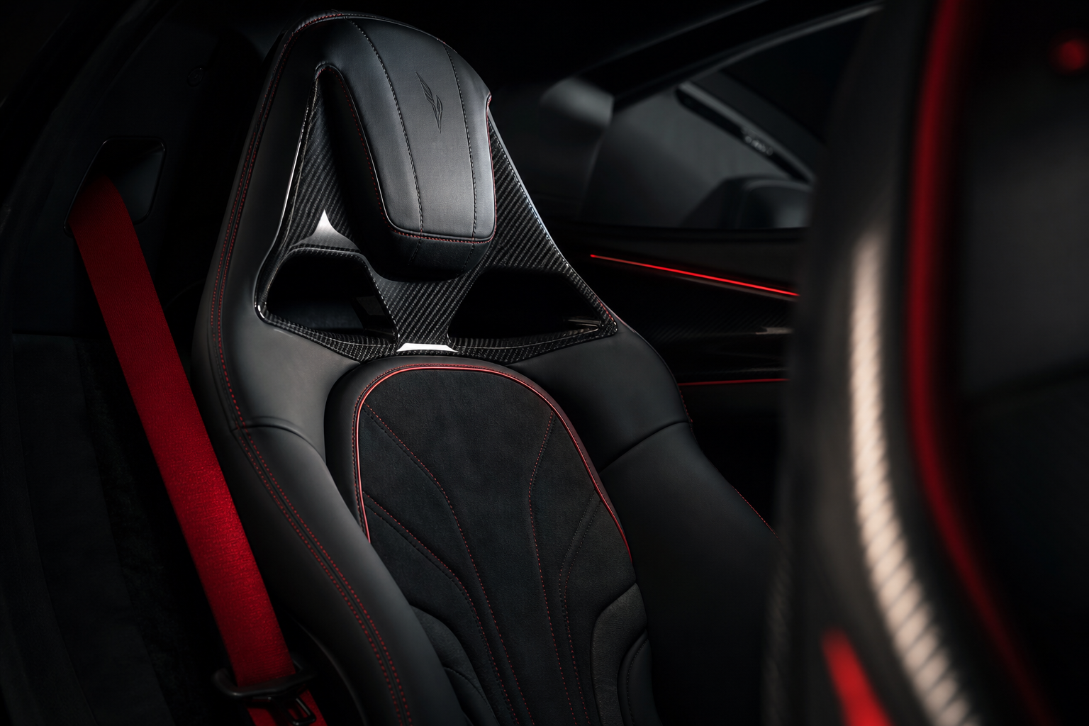 Interior seat material detail showing stitched leather, Alcantara and carbon trim in VELOCITY R9