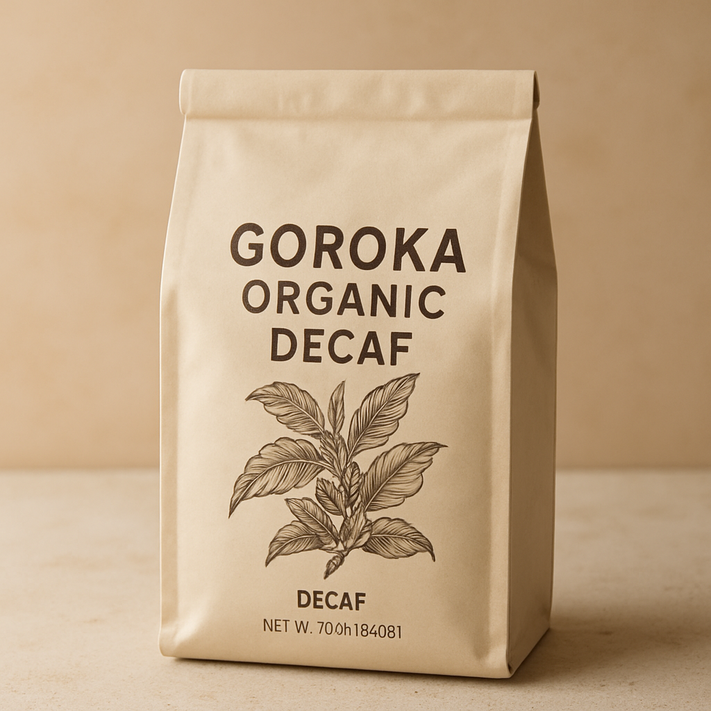 Soft beige decaf coffee bag with botanical illustration labeled Goroka Organic Decaf
