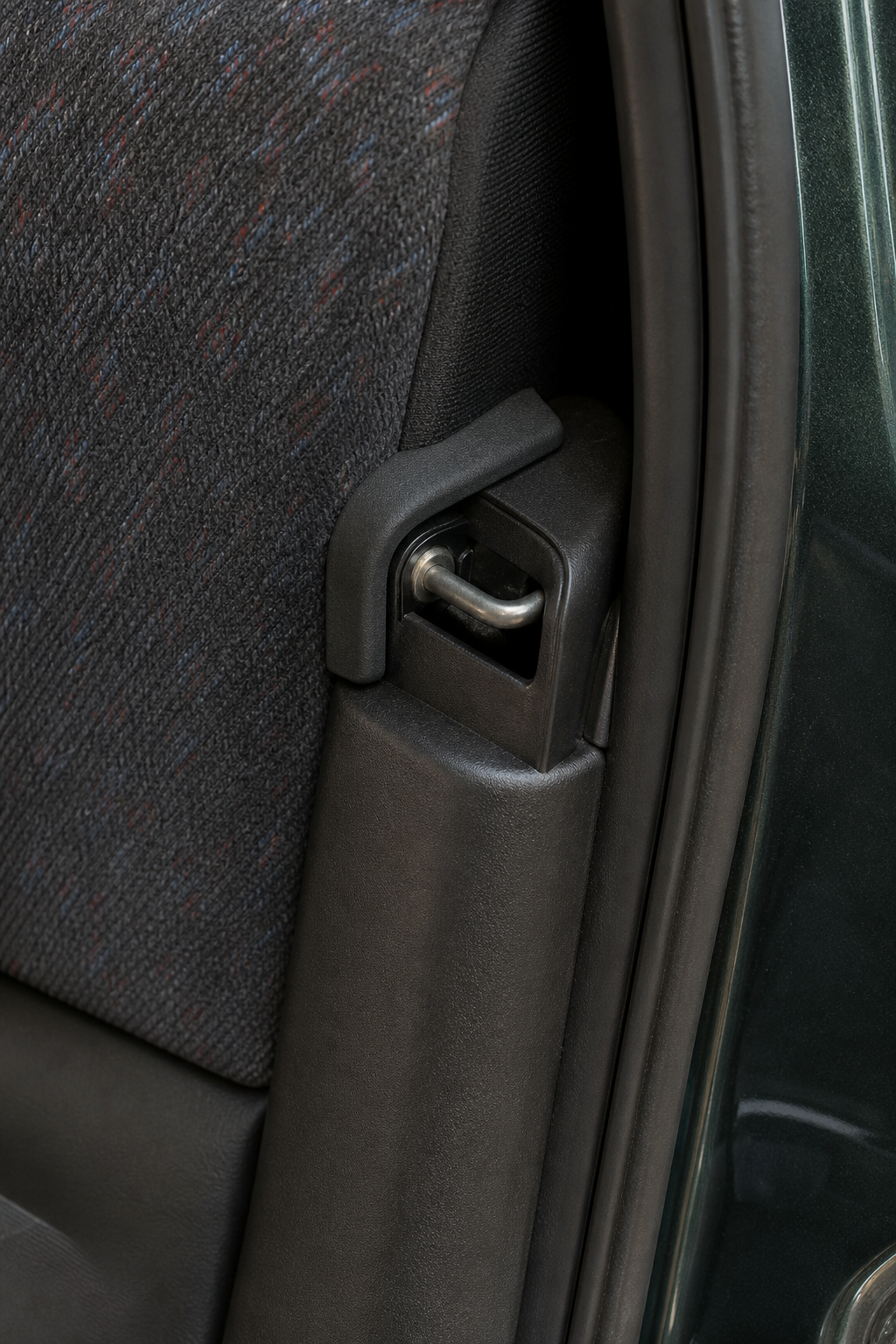 Close detail of an EK hatch interior with a 3D printed trim retention piece installed at the latch area.