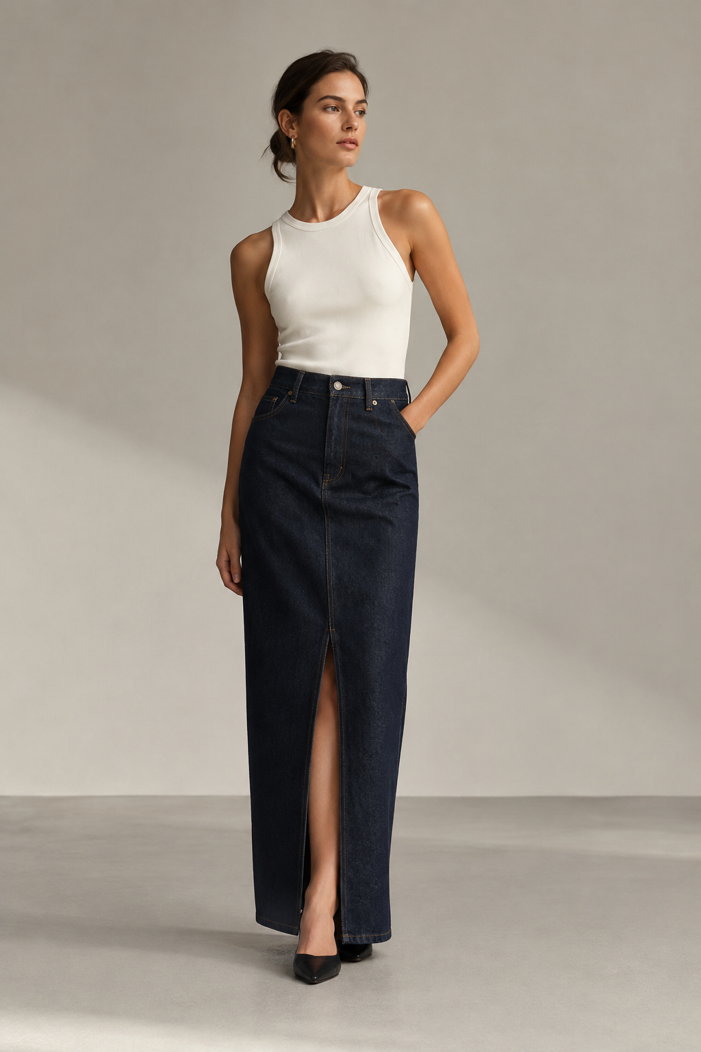 Dark denim column skirt with a streamlined shape and front slit