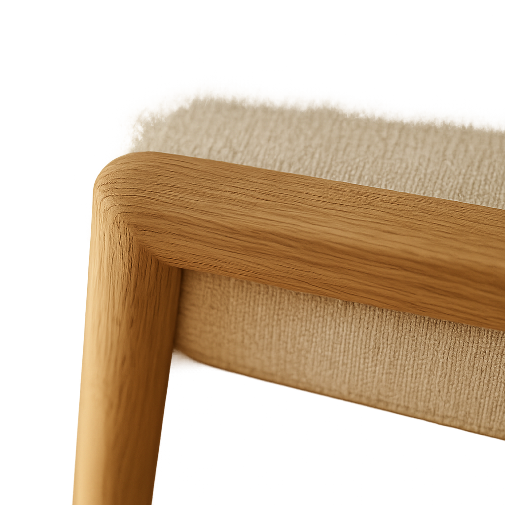 Close-up of warm oak grain and soft woven upholstery
