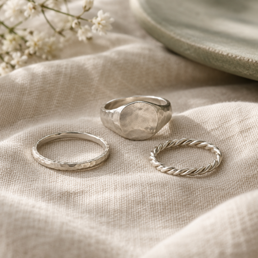 Styled close-up of handmade silver rings