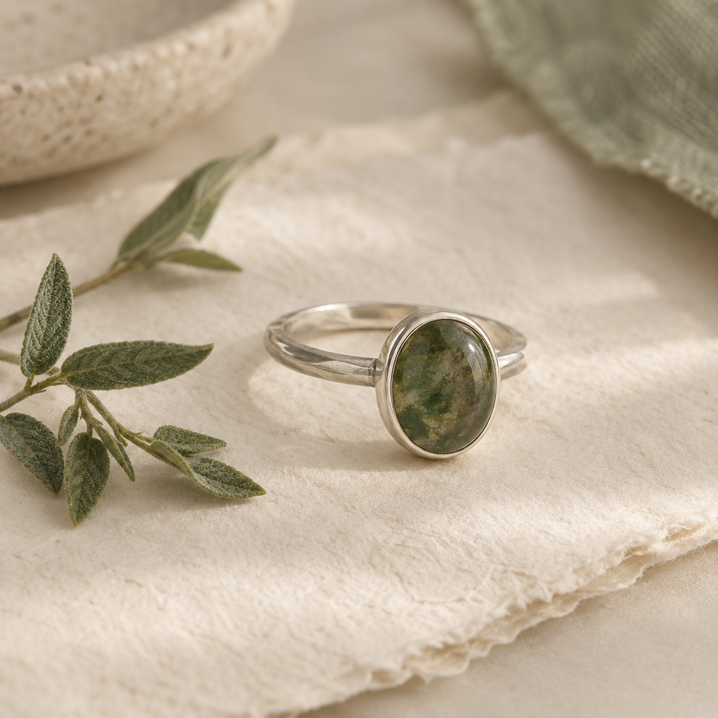 Oval green stone in a recycled silver ring